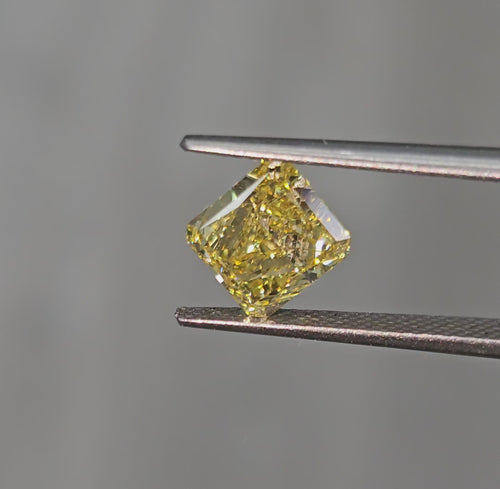 GIA certified Fancy Intense Yellow radiant cut diamond with SI1 clarity and vibrant color.