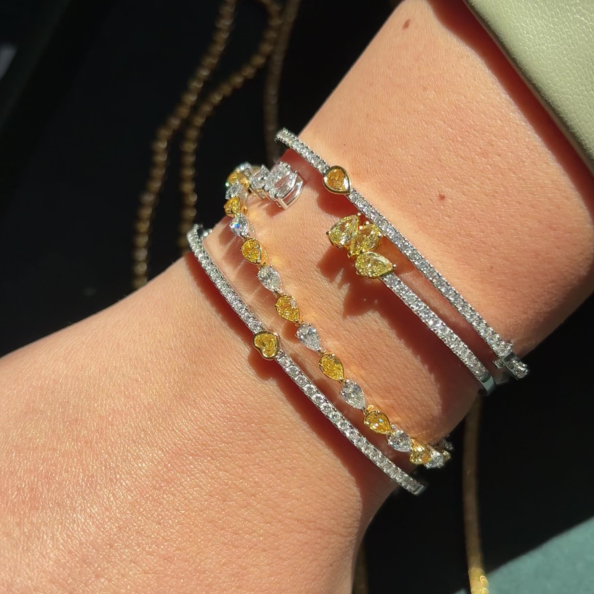 White gold and yellow diamond tennis bracelets with pear cut natural yellow diamonds 