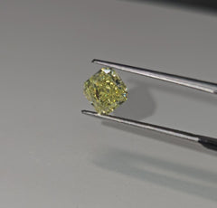 GIA certified elongated radiant cut natural yellow diamond with a unique and vibrant hue.