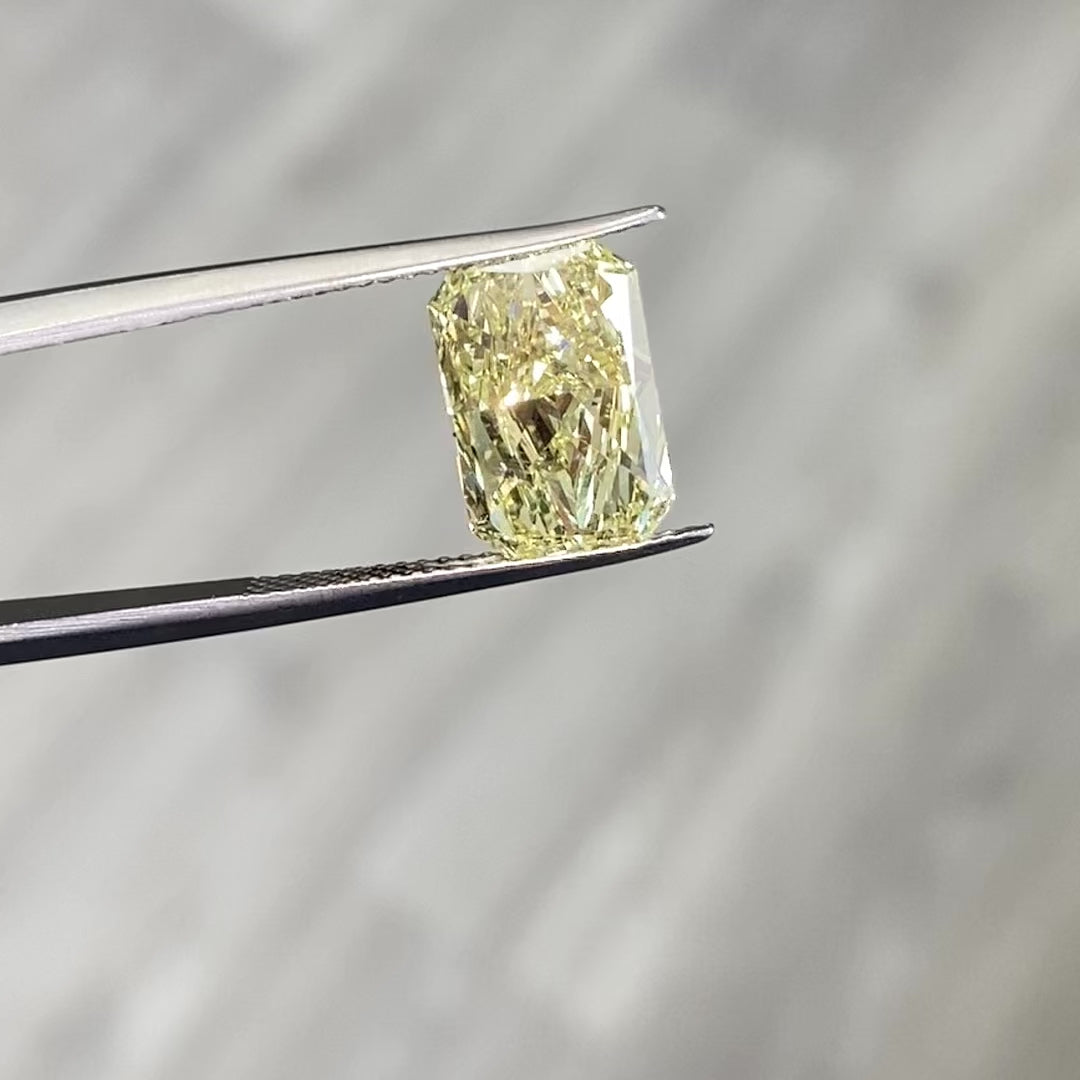 Fancy yellow elongated radiant diamond with VVS2 clarity and excellent cut.