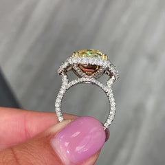 13.30 carat yellow diamond on the center with white surrounding diamonds