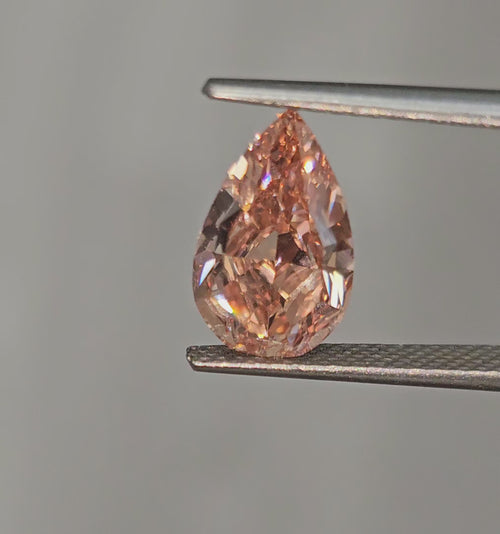 Unique GIA-certified deep brown-pink pear-shaped diamond with stunning VS2 clarity.