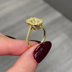Elongated natural yellow diamond ring featuring a GIA-certified light yellow radiant diamond.
