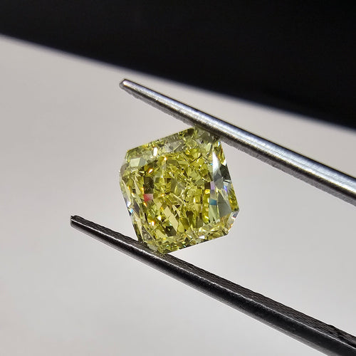 GIA certified elongated radiant cut natural yellow diamond with a unique and vibrant hue.