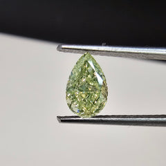 Fancy Light Green-Yellow pear-shaped diamond with VS2 clarity and a stunning hue.