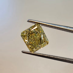 GIA certified Fancy Intense Yellow radiant cut diamond with SI1 clarity and vibrant color. 