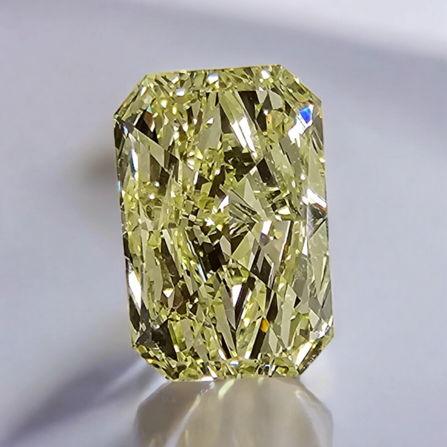 Fancy yellow elongated radiant diamond with VVS2 clarity and excellent cut.