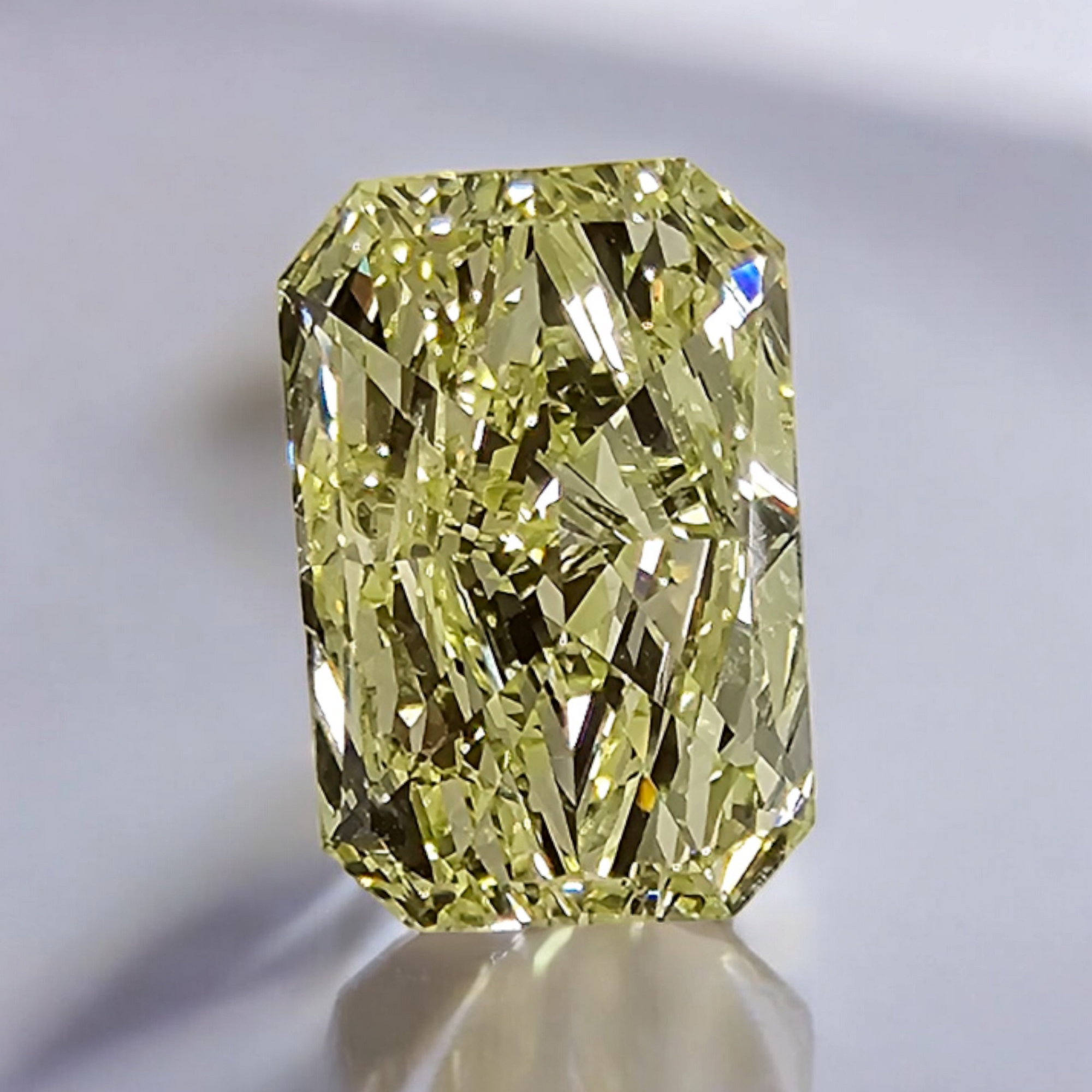 Fancy yellow elongated radiant diamond with VVS2 clarity and excellent cut.