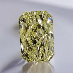 Fancy yellow elongated radiant diamond with VVS2 clarity and excellent cut.