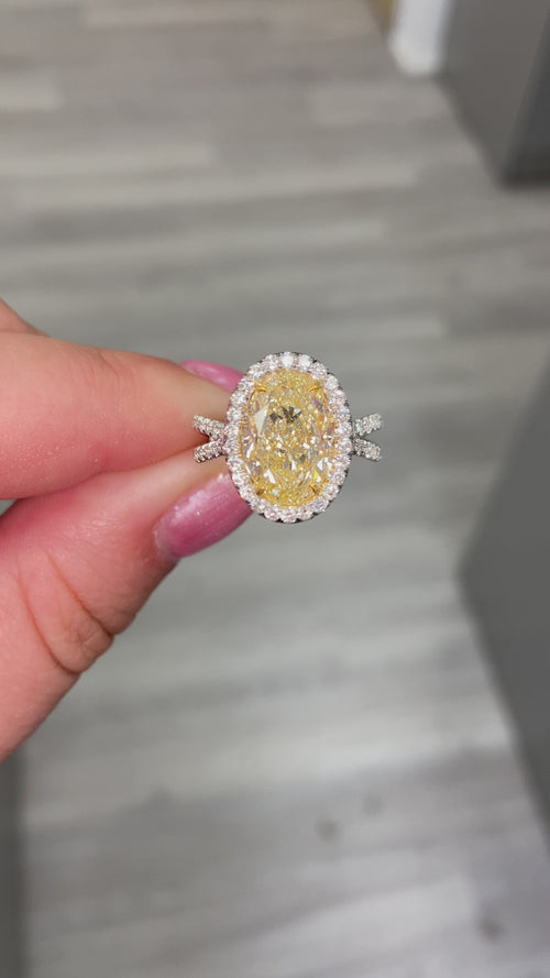 Yellow diamond oval ring. Oval diamond engagement ring. canary yellow oval. halo diamond ring. oval diamond ring