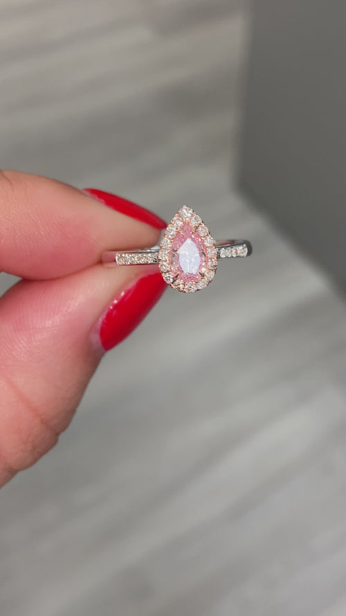  Pink diamond ring. pink diamond engagement ring. light pink diamonds. light pink pear shape. diamond ring. Pear diamond ring.