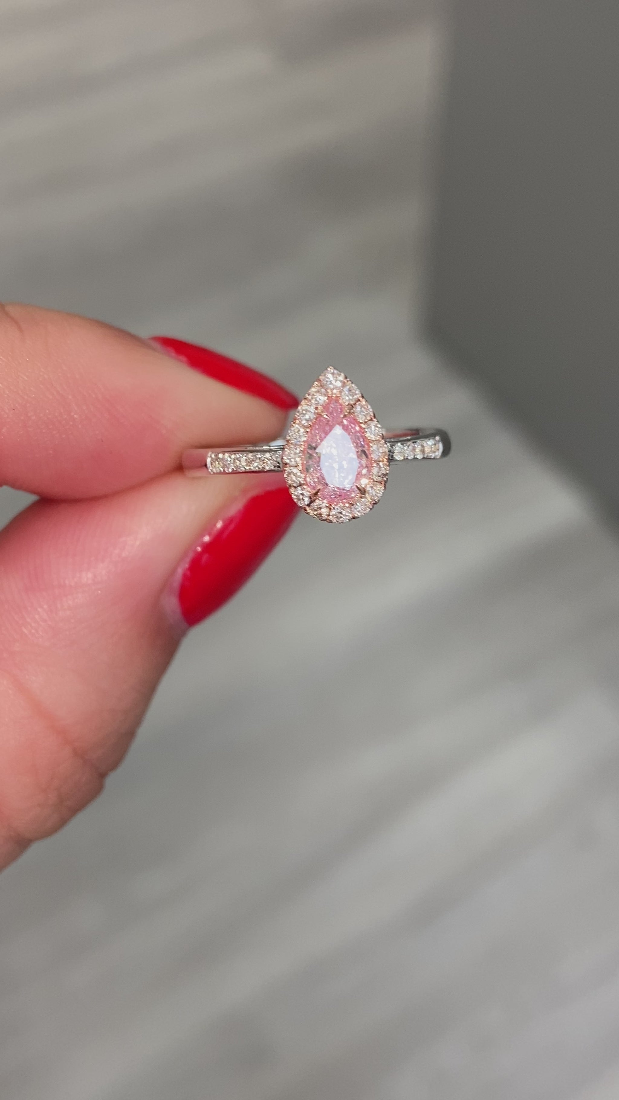  Pink diamond ring. pink diamond engagement ring. light pink diamonds. light pink pear shape. diamond ring. Pear diamond ring.