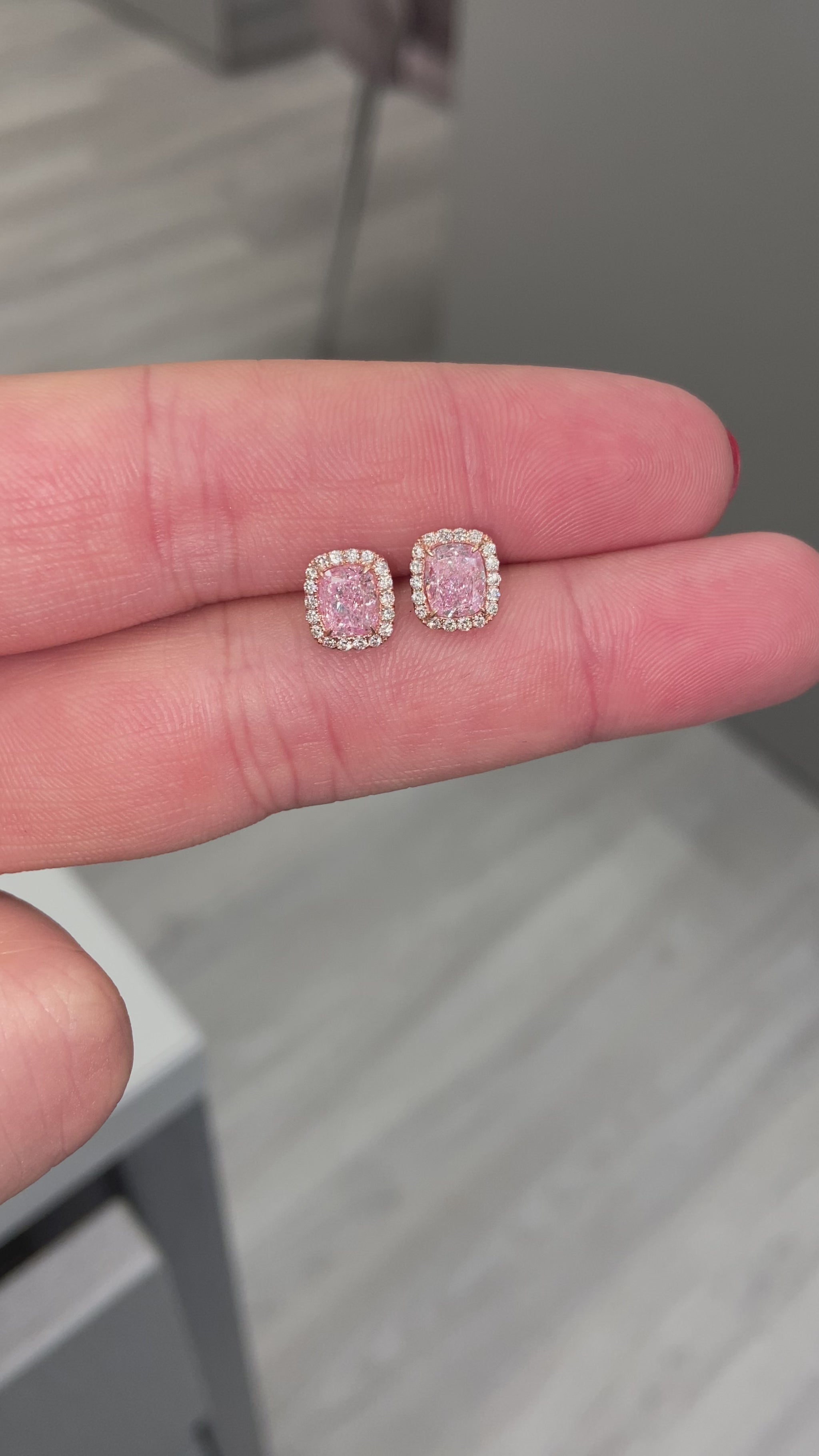 Pink diamond earrings. pink diamond studs. light pink diamonds. light pink cushions. diamond earrings.