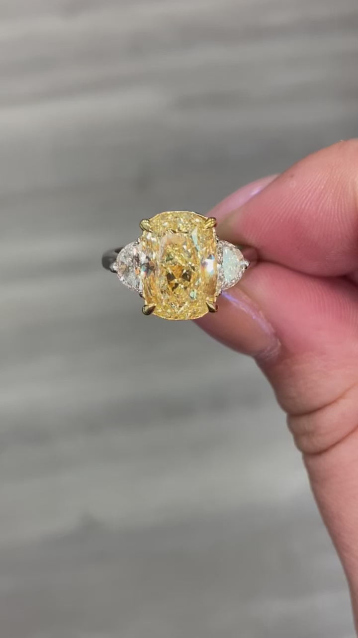 Yellow diamond ring. fancy yellow ring. 5 carat yellow diamond. 5 carat yellow diamond ring. long cushion cut. long cushion yellow diamond. yellow diamonds.