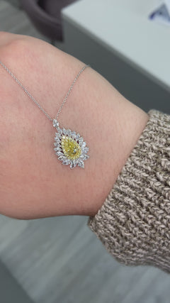 Intense yellow pear shape. Gia certified intense yellow diamond. Yellow diamond necklace. Unique yellow diamond necklace. Yellow diamond pear shape necklace.
