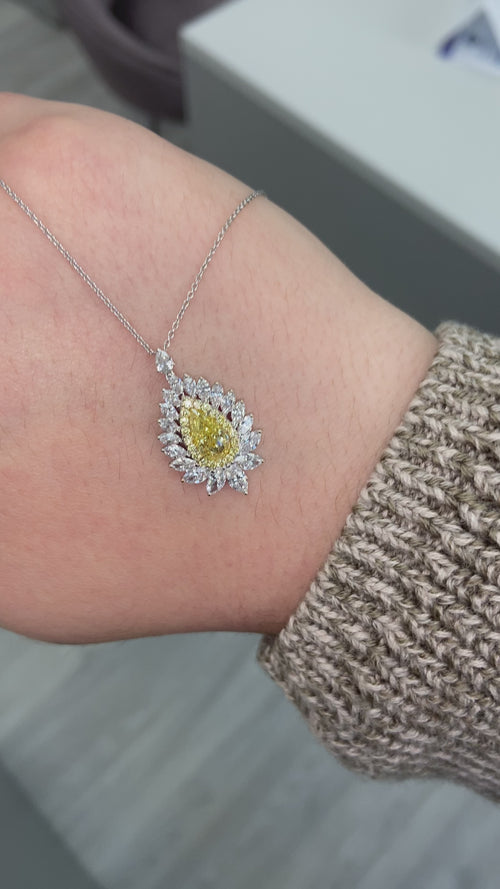 Intense yellow pear shape. Gia certified intense yellow diamond. Yellow diamond necklace. Unique yellow diamond necklace. Yellow diamond pear shape necklace.