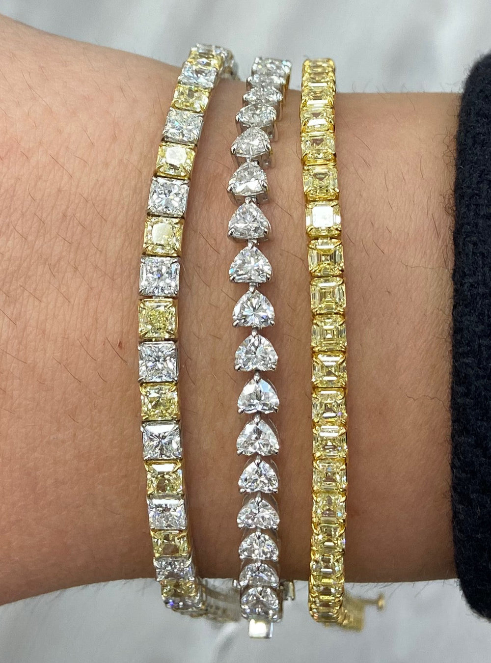 Alternating yellow and white diamond bracelet. tennis bracelet. alternating diamond bracelet. yellow diamond cushions.