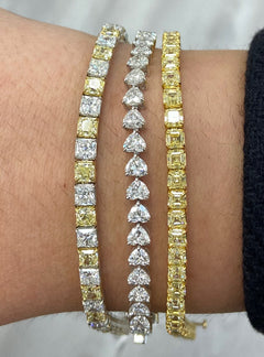 Alternating yellow and white diamond bracelet. tennis bracelet. alternating diamond bracelet. yellow diamond cushions.