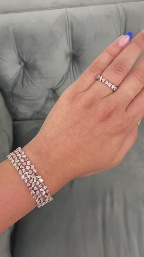 Unique natural light pink and white diamond eternity band.