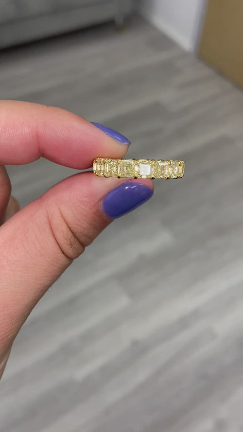 Fancy yellow diamond asscher cut eternity band.