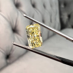 Elongated fancy intense yellow diamond radiant cut. Long yellow diamond radiant cut. Long radiant diamond. Fancy intense yellow. 