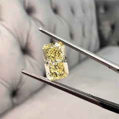 Elongated fancy intense yellow diamond radiant cut. Long yellow diamond radiant cut. Long radiant diamond. Fancy intense yellow. 
