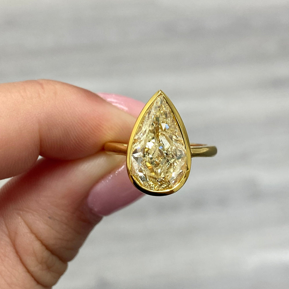 GIA 5ct Light Yellow Pear diamond engagement ring at Rare Colors by Namdar, 5th Avenue New York