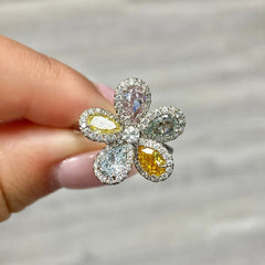 Unique flower-shaped ring featuring a vibrant array of GIA-certified multicolor diamonds.